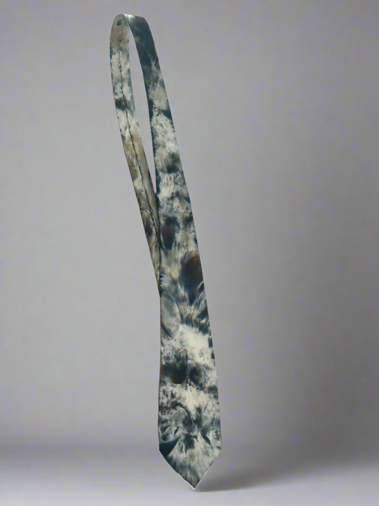 Tie with a tie-dye pattern on a white background