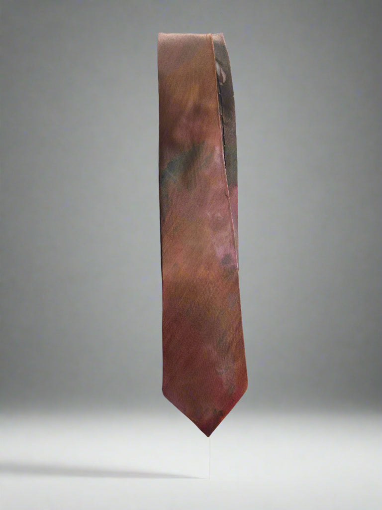Brown tie on a light gray background